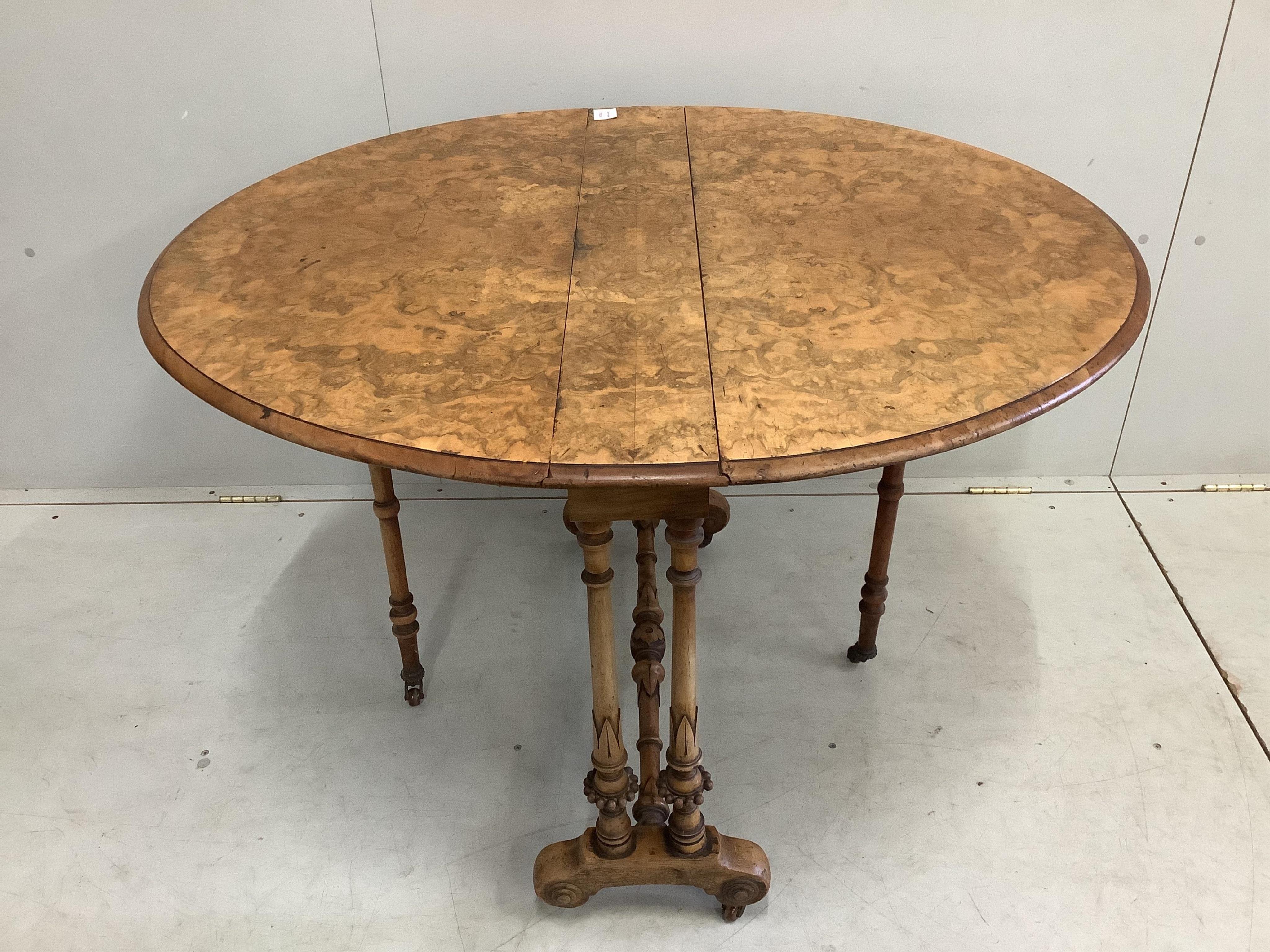 A Victorian burr walnut Sutherland table, width 90cm, height 71cm. Condition - fair